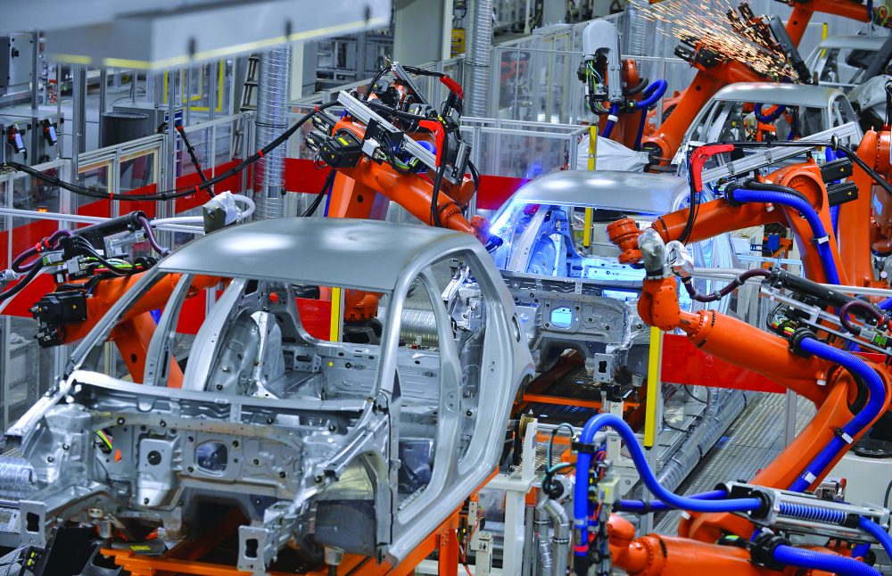 Sustainable Manufacturing - robots welding in an automobile factory